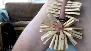 Wooden clothespins on the cock