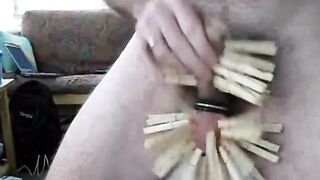 Wooden clothespins on the cock