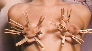 Horny dude loves putting clothes pegs on his slaves tits