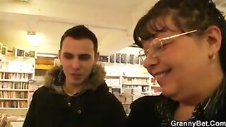 Fat mature bookworm is seduced and fucked by young guy